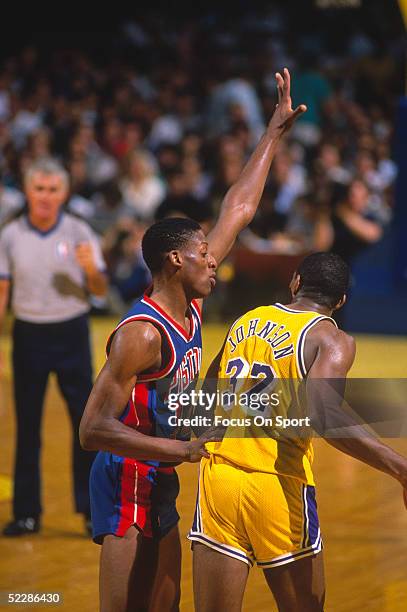 Detroit Pistons' Dennis Rodman guards against the Los Angeles Lakers' Magic Johnson during the 1988 NBA Playoffs at the Great Western Forum in...