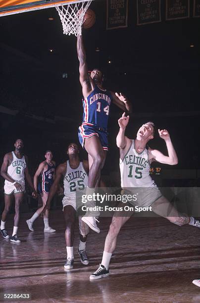 Cincinnati Royals's Oscar Robertson goes for a layup against the Boston Celtics during a game in 1964 at the Boston Garden in Boston, Massachusetts.