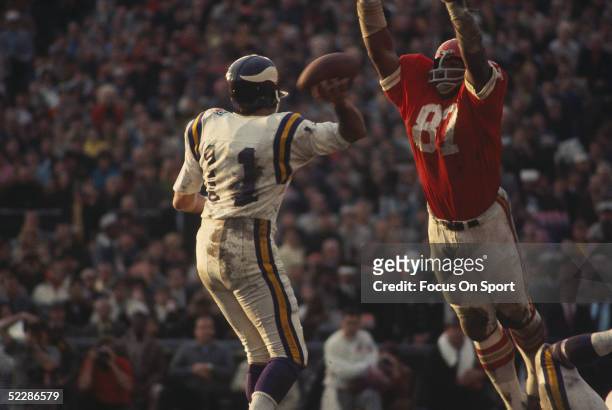 Minnesota Vikings' quarterback Joe Kapp looks to pass over defensive end Aaron brown of the Kansas City Chiefs during Super Bowl IV at Tulane Stadium...