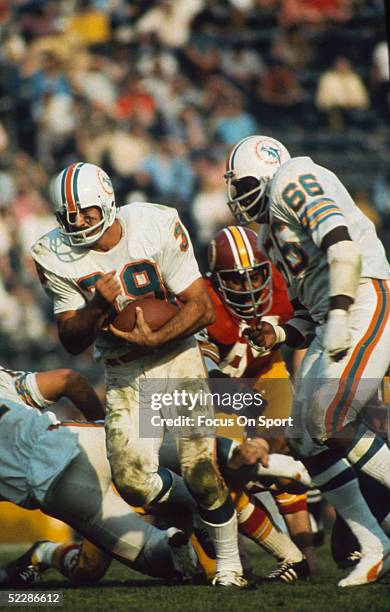 Miami Dolphins' running back Larry Csonka runs with the ball against the Washington Red Skings during Super Bowl VII at Memorial Coliseum on January...