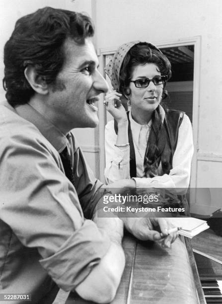 American country singer Bobbie Gentry discusses ideas for her new BBC TV show with director Stanley Dorfman, July 1968.