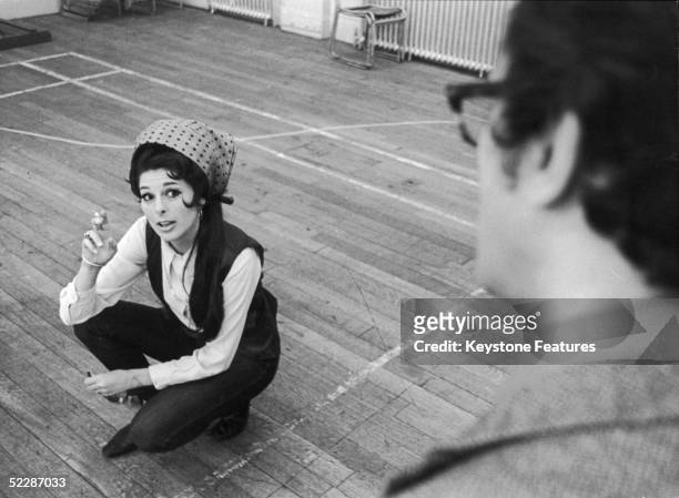 American country singer Bobbie Gentry discusses ideas for her new BBC TV show with musical director John Cameron, July 1968.