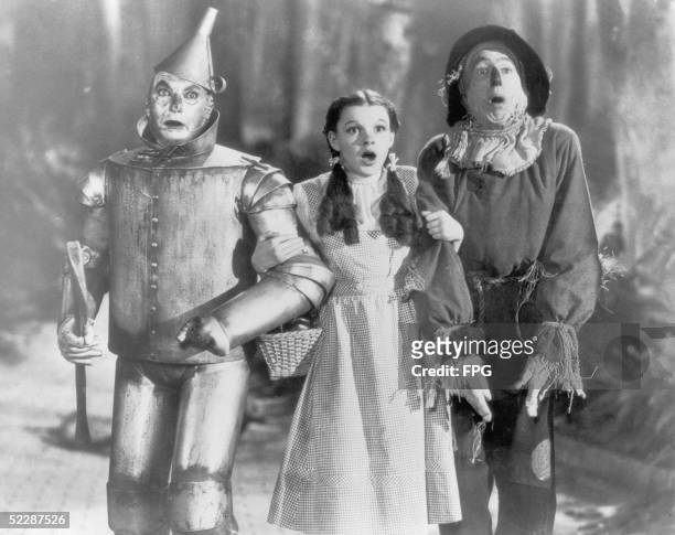 The Tin Man , Dorothy and the Scarecrow set off on their quest for fulfillment in the children's classic 'The Wizard of Oz', directed by Victor...