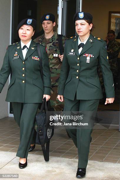 Army Spc.Sabrina D. Harmon accompanied by her attorney Capt. Patsy Takemura leaves the courthouse after a pre-trail hearing March 7 in Fort Hood,...