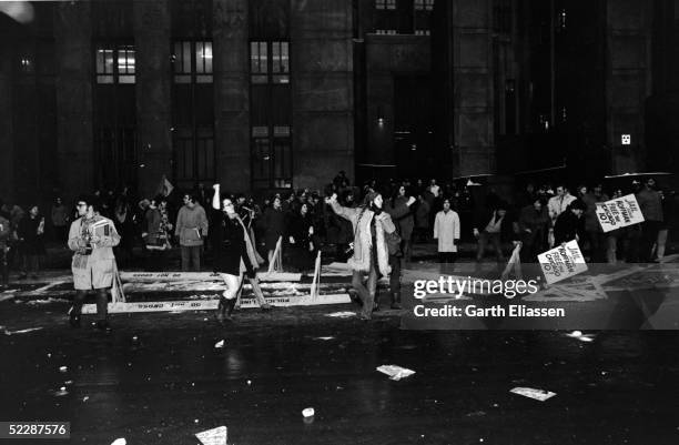 After the barricades are broken, demonstrators spill into the streets in front of the Criminal Courts Building, New York, New York, February 16,...