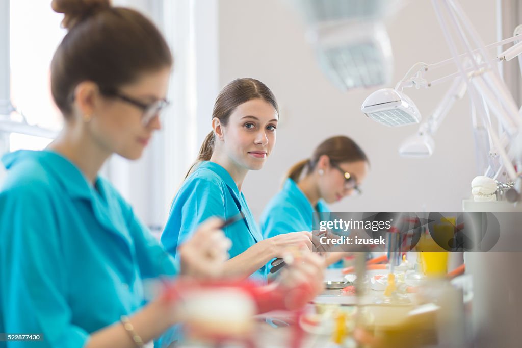 Female students learning prosthetic dentistry