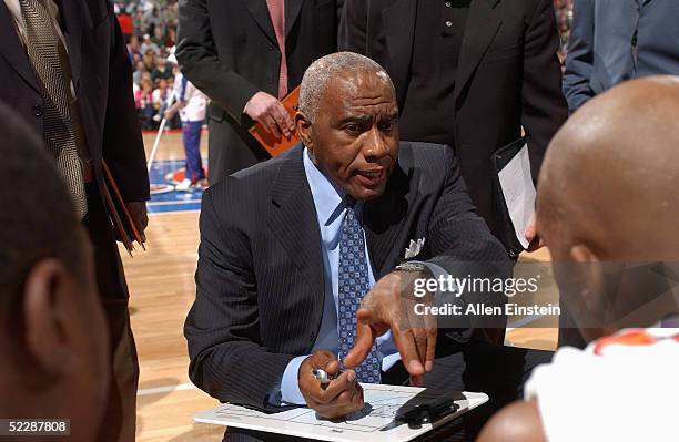 Assistant coach Garfield Heard of the Detroit Pistons talks to his teammates during the game against the New York Knicks at The Palace of Auburn...