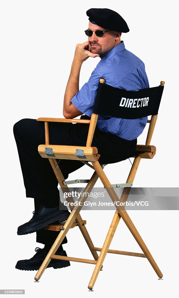 Film Director Sitting in his Director's Chair
