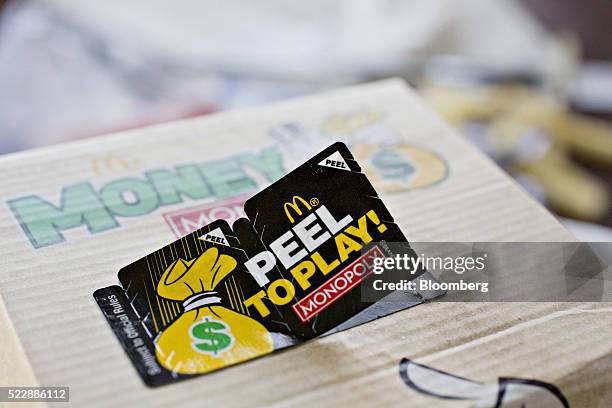 Monopoly Peel to Play game sticker is seen on a McDonald's Corp. Big Mac hamburger arranged for a photograph in Tiskilwa, Illinois, U.S., on Friday,...