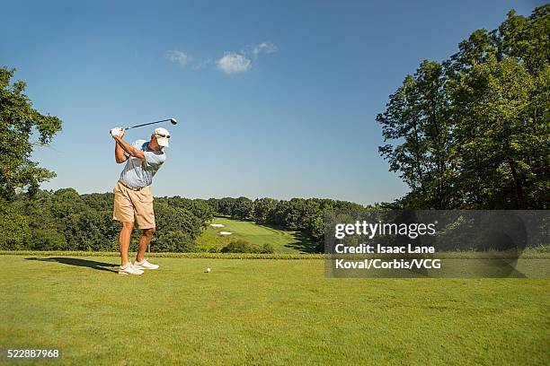 man playing golf - senior men golf stock pictures, royalty-free photos & images