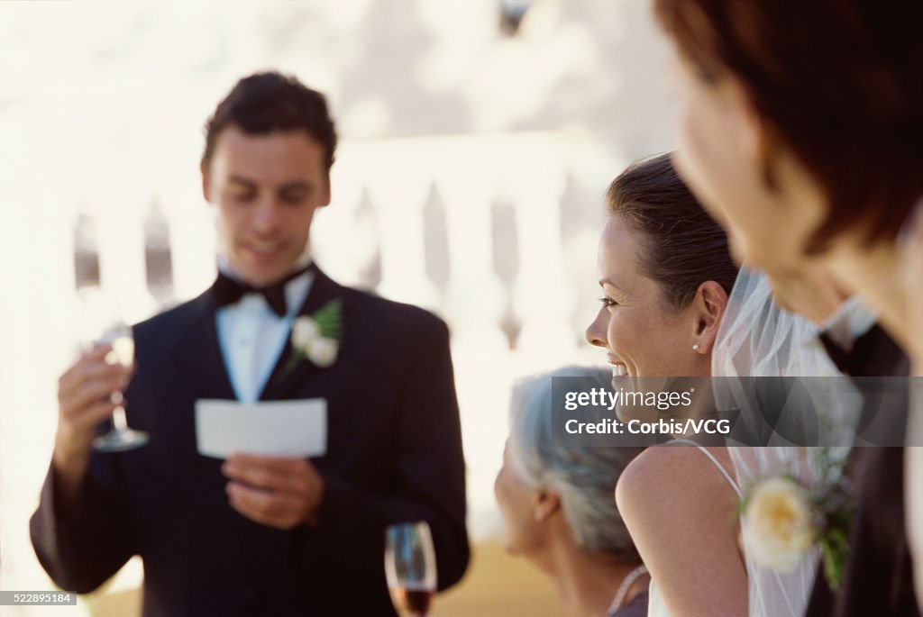 View of the best man making a speech at a wedding reception