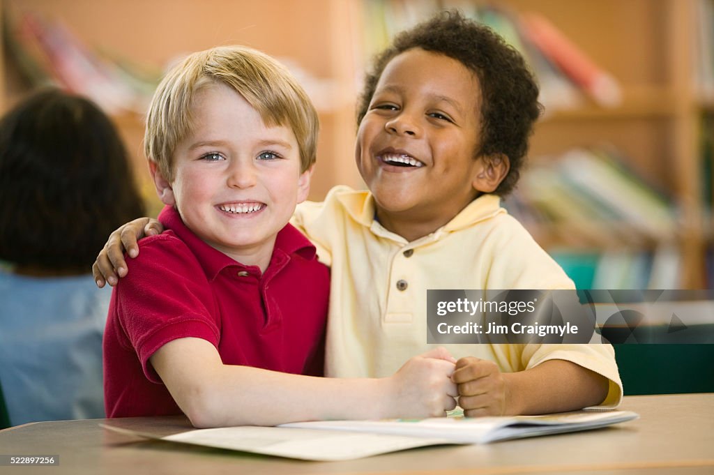 Sharing Books Elementary School Friends Sharing Book High-Res Stock Photo - Getty Images