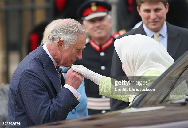 Queen Elizabeth II is greeted by Prince Charles, Prince of Wales as she attends a becaon lighting ceremony to celebrate her 90th birthday on April...