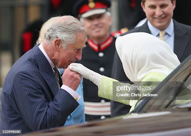 Queen Elizabeth II is greeted by Prince Charles, Prince of Wales as she attends a becaon lighting ceremony to celebrate her 90th birthday on April...