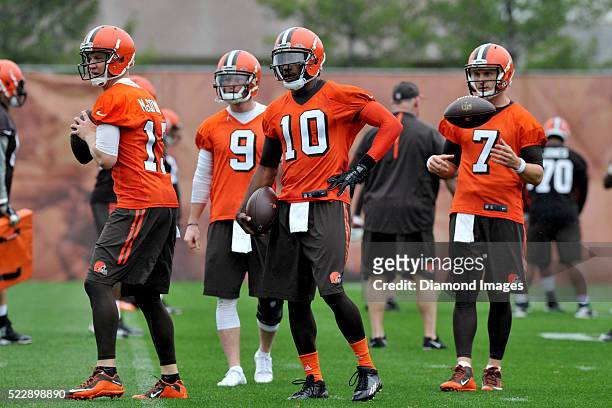 Quarterbacks Robert Griffin III, Josh McCown, Austin Davis, and Connor Shaw of the Cleveland Browns take part in drills during a voluntary mini camp...