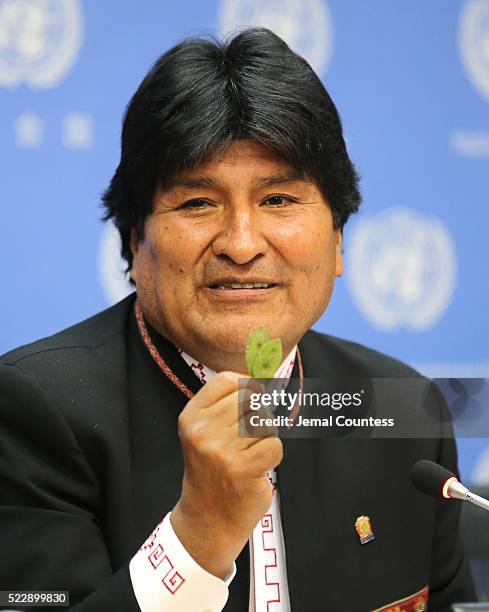 President of the PluriNational State of Bolivia Evo Morales Ayma holds up a coca leaf during his comments about the right of Bolivian farmers to grow...