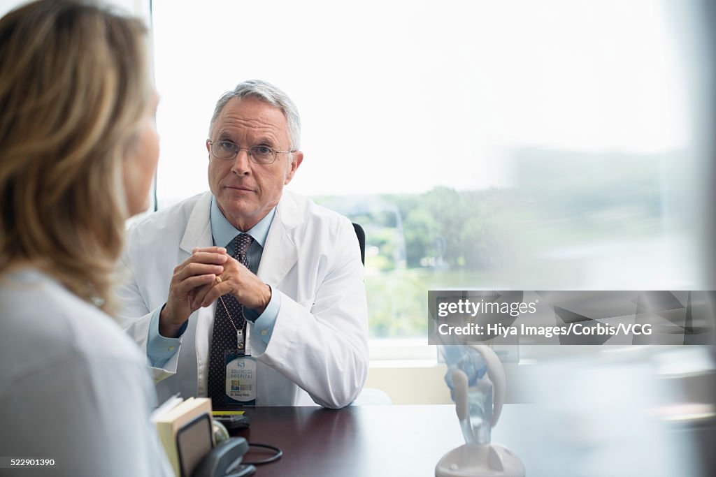 Doctor listening to patient