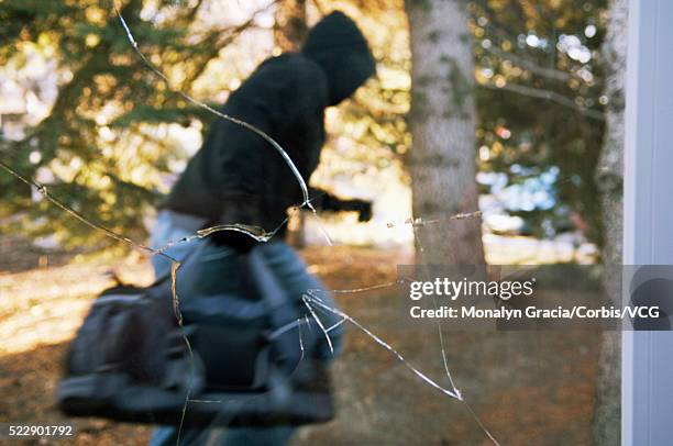 thief escaping with bag of loot - burglar carried stock pictures, royalty-free photos & images