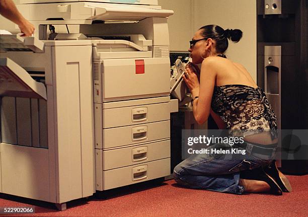 office worker fixing broken printer - computer printer stock pictures, royalty-free photos & images