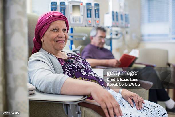 patients in infusion room - chemotherapy man stock pictures, royalty-free photos & images
