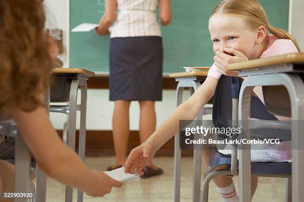 Passing Through Notes Kids Passing Note Photos and Premium High Res Pictures - Getty Images
