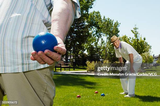 senior men playing bocce - bocce ball stock pictures, royalty-free photos & images