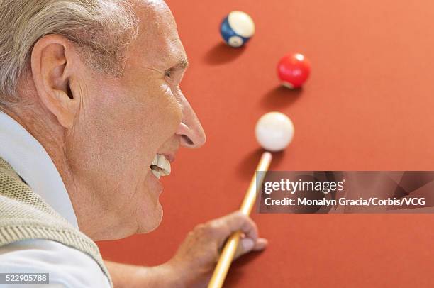 senior man playing pool - poolbillard billard stock-fotos und bilder