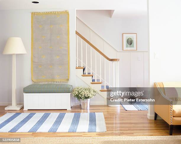 tapestry and striped rugs in colorful entryway - tapestry stock pictures, royalty-free photos & images