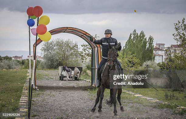 Gendarme rides a horse during a training at the Gendarme Horse and Dog Training Center in Nevsehir, Turkey on April 21, 2016. Horses and dogs are...