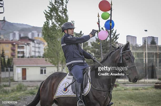Gendarme rides a horse during a training at the Gendarme Horse and Dog Training Center in Nevsehir, Turkey on April 21, 2016. Horses and dogs are...