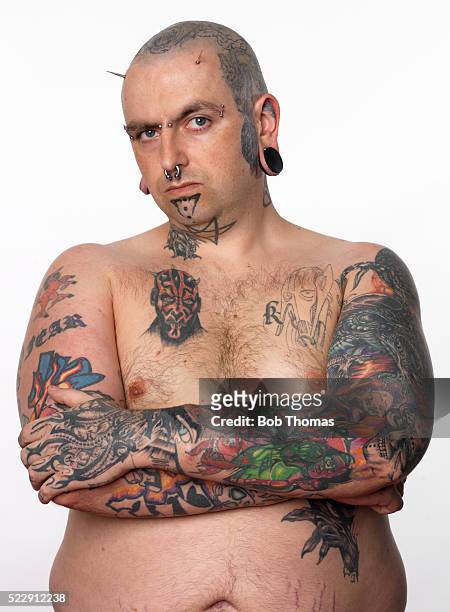 portrait of man with body art - body piercings stock pictures, royalty-free photos & images