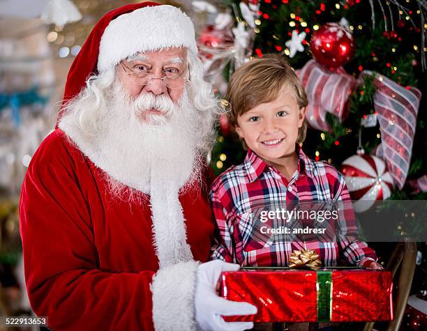 happy santa with a kid - happy santa claus over white blank stockfoto's en -beelden