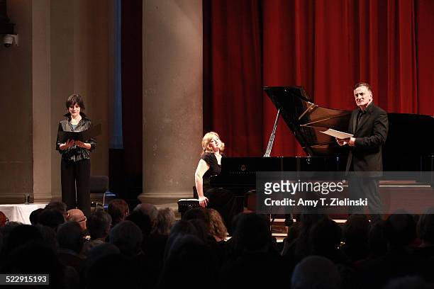 Actress Dame Harriet Walter as Clara Schumann and actor Henry Goodman as Robert Schumann as pianist Lucy Parham plays at a Steinway piano during a...