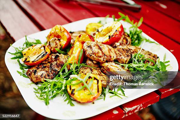 grilled chicken with nectarines and arugula - nectarine stock pictures, royalty-free photos & images