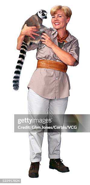 zookeeper holding a lemur - zoo keeper stock pictures, royalty-free photos & images