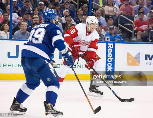 Nikita Nesterov of the Tampa Bay Lightning defends against Joakim Andersson of the Detroit Red Wings during the second period of Game One of the...