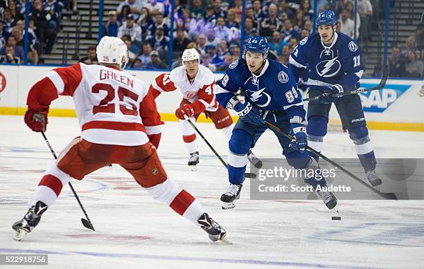 Nikita Nesterov of the Tampa Bay Lightning skates against the Mike Green of Detroit Red Wings during the third period of Game One of the Eastern...