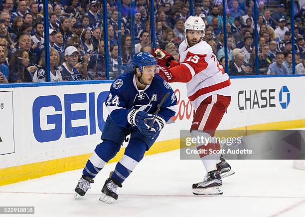 Ryan Callahan of the Tampa Bay Lightning skates against Riley Sheahan of the Detroit Red Wings during the third period of Game One of the Eastern...