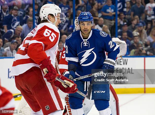 Cedric Paquette of the Tampa Bay Lightning skates against Danny DeKeyser of the Detroit Red Wings during the third period of Game One of the Eastern...