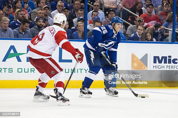 Ryan Callahan of the Tampa Bay Lightning skates against Justin Abdelkader of the Detroit Red Wings during the third period of Game One of the Eastern...