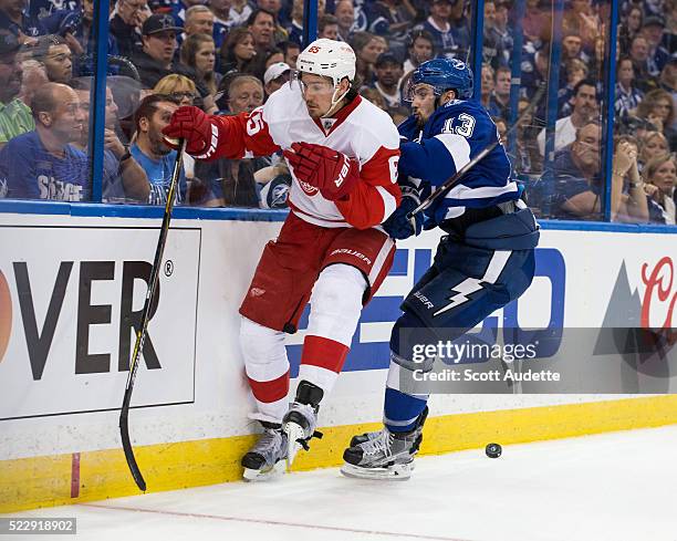 Cedric Paquette of the Tampa Bay Lightning skates against Danny DeKeyser of the Detroit Red Wings during the third period of Game One of the Eastern...