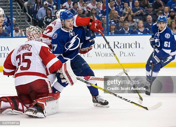 Jonathan Drouin of the Tampa Bay Lightning skates against goalie Jimmy Howard of the Detroit Red Wings during the third period of Game One of the...