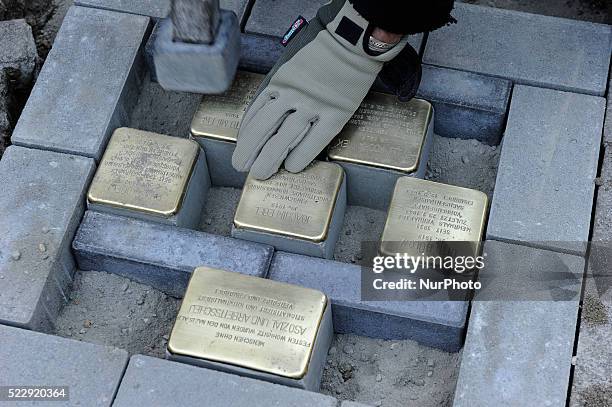 The artist Gunter Demnig pose the Stolpersteine in Berlin on April 21, 2016. The project commemorates people who were persecuted as 'asocial' by the...