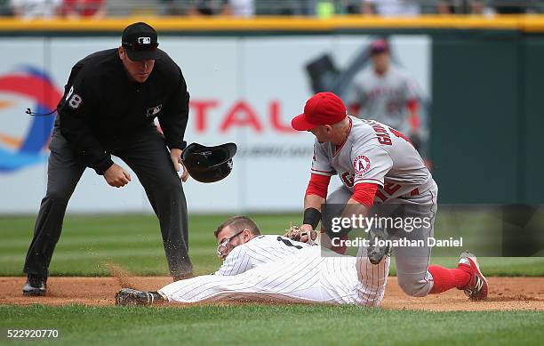 Brett Lawrie of the Chicago White Sox dives safely into second base with a double ahead of the tag by Johnny Giavotella of the Los Angeles Angels in...