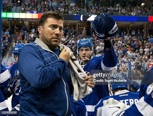 Tampa Bay Lightning Equipment Manager Ray Thill calls for new gloves for Victor Hedman against the Detroit Red Wings during the third period of Game...