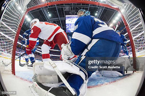 Goalie Ben Bishop of the Tampa Bay Lightning tends net against Gustav Nyquist of the Detroit Red Wings during the first period of Game One of the...