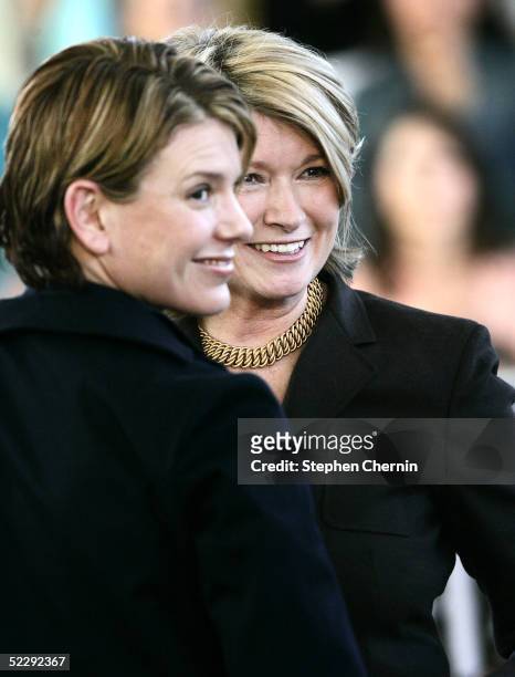Martha Stewart and her daughter, Alexis, smile as employees applaud her after speaking on her first day back to her offices since her incarceration...