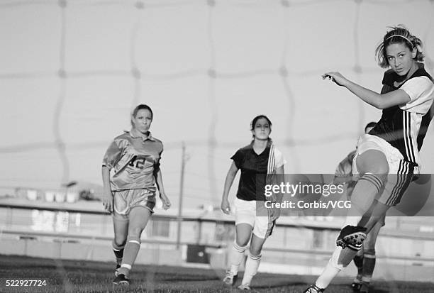 soccer player kicking ball - vintage football player stock pictures, royalty-free photos & images