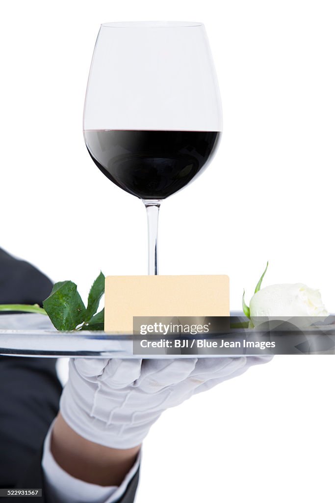 Waiter serving wine