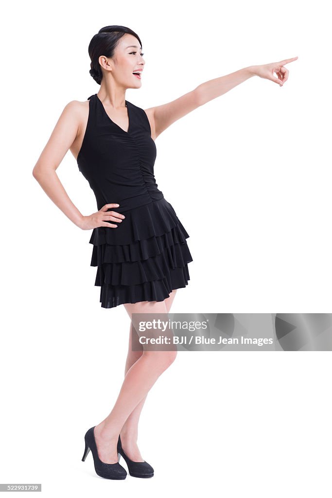 Happy young woman pointing